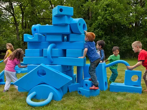 Image of children playing with blue blocks